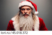 Santa Claus Tired, tortured, in red suit showing signs of exhaustion, candid capture of holiday fatigue, slump after delivering joy, seasonal weariness evident in posture. Стоковое фото, фотограф Павел Муравьев / Фотобанк Лори