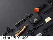 An Assortment of Professional Hairdressing Tools Laid Out on a Dark Surface. Стоковое фото, фотограф Сергей Толмачёв / Фотобанк Лори