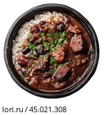 Feijoada served with white rice and parsley in black bowl. Стоковое AI-изображение, AI-художник Иван Рябоконь / Фотобанк Лори