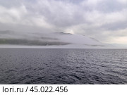 Туман над озером Байкалом. Исток Ангары. Мыс Устьянский (2024 год). Стоковое фото, фотограф Александр Тараканов / Фотобанк Лори