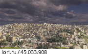 View of the modern houses Amman, Jordan, Middle East. Against the background of a beautiful sky with clouds. Стоковое видео, видеограф Владимир Журавлев / Фотобанк Лори