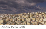 View of the modern houses Amman, Jordan, Middle East. Against the background of a beautiful sky with clouds. Стоковое видео, видеограф Владимир Журавлев / Фотобанк Лори