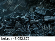 Pile of mined coal is awaiting further processing. Стоковое AI-изображение, AI-художник Иван Рябоконь / Фотобанк Лори