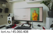 The artificial intelligence program generates an image according to a given prompt on a large monitor of a home computer. The chair is empty. Concept: AI replaces human creative work. Стоковое AI-видео, аниматор Енваев Андрей / Фотобанк Лори