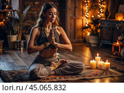 The concept of esoteric spiritual meditation, a woman in the lotus position. Human meditation, spirituality and chakra activation, mystical spirit. Стоковое AI-изображение, AI-художник Photojuli / Фотобанк Лори