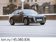 Hongqi H5 on the road in motion. Fast speed drive on city road. Front side view of moving black car on the street. Редакционное фото, фотограф Константин Григорьев / Фотобанк Лори