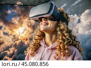 A young beautiful girl in a pink hoodie playing virtual reality in fabulous pink clouds with a virtual reality headset in front of her eyes. Стоковое AI-изображение, AI-художник Photojuli / Фотобанк Лори