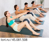 Girl participates in group lesson with sof tball, modern sport in studio. Стоковое фото, фотограф Яков Филимонов / Фотобанк Лори