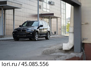 KRASNOYARSK, RUSSIA - June 15, 2024: Black BMW X5 E70. Редакционное фото, фотограф Плотников Дмитрий / Фотобанк Лори
