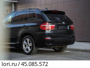KRASNOYARSK, RUSSIA - June 15, 2024: Black BMW X5 E70. Редакционное фото, фотограф Плотников Дмитрий / Фотобанк Лори