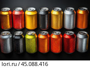 Multicolor abstract pattern many soda drinks cans top view on dark background. Recycling aluminum or metal empty cans from above. Group of cans for reuse and recycle. Стоковое AI-изображение, AI-художник Ирина Михайличенко / Фотобанк Лори