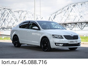 KRASNOYARSK, RUSSIA - August 3, 2024: White Skoda Octavia III A7. Редакционное фото, фотограф Плотников Дмитрий / Фотобанк Лори