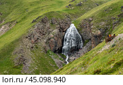 Mountain landscape with waterfall. natural background, trekking, mountain walks, healthy and active lifestyle. Girl's braids waterfall. Стоковое фото, фотограф Павел Муравьев / Фотобанк Лори