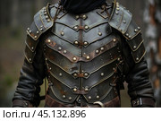 Medieval warrior wearing chest plate armor standing in a forest. Стоковое AI-изображение, AI-художник Иван Рябоконь / Фотобанк Лори
