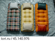 Three camping mattresses lying on tarp, preparing for overnight stay. Стоковое AI-изображение, AI-художник Иван Рябоконь / Фотобанк Лори