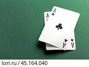 Cards and chips for poker on green table. Стоковое фото, фотограф Сергей Толмачёв / Фотобанк Лори