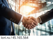Close up view of a firm handshake businessmen  entrepreneurs on a background of modern office lit by sunlight. Стоковое AI-изображение, AI-художник Михаил Строгалев / Фотобанк Лори