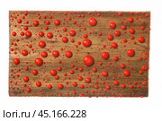 Beautiful colorful water droplets on a wooden frame. Red drops of paint. Стоковое фото, фотограф Александр Собко / Фотобанк Лори