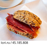 Sandwiches bocadillo from baguette filled with sliced ham. Traditional Spanish food. Стоковое фото, фотограф Яков Филимонов / Фотобанк Лори