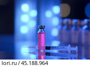 Glass ampoule with clear pink liquid and a syringe. Syringe next to the vial. Medicine bottle. Syringe of botulinum toxin, hualuronic, collagen or flu on a blue medical laboratory background. Close Up. Стоковое AI-изображение, AI-художник Марина Демидюк / Фотобанк Лори