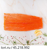 Food background, salmon steaks and seasonings. Стоковое фото, фотограф Natalia Gdovskaia / Фотобанк Лори