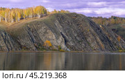 Склоны у реки с осенними деревьями. Стоковое фото, фотограф Руслан Кадыров / Фотобанк Лори