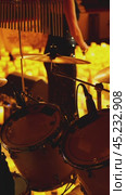 A close-up of a drummer striking sticks on cymbals on a drum kit. Slow motion. The stage is dimly lit by burning candles. Стоковое видео, видеограф Воловодов Владимир / Фотобанк Лори
