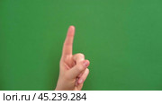 Female hand making warning gesture on Chroma key. Human hand showing her denial with index finger motion isolated on green. Stop sign, refusal, caution. Preventing subsequent problems. Body language. Стоковое видео, видеограф Марина Демидюк / Фотобанк Лори