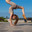 Fitness portrait young athletic woman doing gymnastics on blue sky background. Стоковое фото, фотограф Андрей Аркуша / Фотобанк Лори