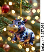 A plump pachyderm hippo on a Christmas tree, a colorful Christmas tree toy. New Year's decor. Festive New Year's atmosphere. Стоковое AI-изображение, AI-художник Сергей Елизарьев / Фотобанк Лори