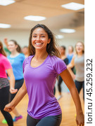 Young woman smiling and leading zumba class in gym. Стоковое AI-изображение, AI-художник Юрий Поздников / Фотобанк Лори