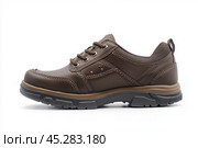 Dark brown leather lace-up running shoes with low tops, thick soles. The laces and black rubber outsole. Sporty look. Men to wear during outdoor activities, hiking. Brown shoes. Trendy Male Boots Pair. Стоковое AI-изображение, AI-художник Марина Демидюк / Фотобанк Лори