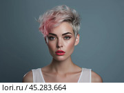 Fashion portrait of beautiful caucasian young woman isolated on colorful studio background. Complicated girl looks puzzled, frowning, sulking while thinking, makes decision, feel suspicious disbelief. Стоковое AI-изображение, AI-художник Sergey Grishin / Фотобанк Лори
