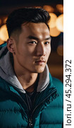 A young man with a confident expression poses against a backdrop of colorful lights at night in urban setting. A resident of Kazakhstan, a cute man of 25 years old. Student or applicant. AI generated. Стоковое AI-изображение, AI-художник Юлия Петровская / Фотобанк Лори