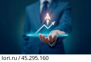 Rocket growth. Entrepreneur showing rocket ship taking off against upward arrow graph, depicting explosive business growth, successful startup launch, and skyrocketing profits. Стоковое AI-изображение, AI-художник Павел Муравьев / Фотобанк Лори