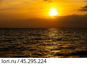 Fiery horizon, dramatic ocean sunset in vibrant hues over dark waters, nature breathtaking photo reflecting artistry of dusk's tranquil spectacle and coastal beauty. Стоковое фото, фотограф Павел Муравьев / Фотобанк Лори