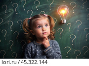 Development and education of children. A thoughtful girls on a dark background with a light bulb and question marks . Brainstorming and the concept of an idea. Стоковое AI-изображение, AI-художник Photojuli / Фотобанк Лори