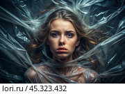 The girl is wrapped in cellophane or a bag. The girl is suffocating. Plastic pollution of the planet. Environmental hazard. Reducing the reuse of plastic. Recycling. The concept of garbage. Стоковое AI-изображение, AI-художник Photojuli / Фотобанк Лори