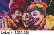 Three happy clowns smiling together at the circus. Стоковое AI-видео, аниматор Юрий Поздников / Фотобанк Лори
