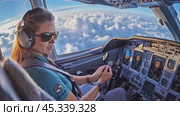 Female pilot flying above the clouds in airplane cockpit. Стоковое AI-видео, аниматор Юрий Поздников / Фотобанк Лори