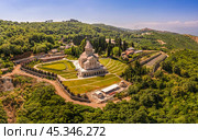 Aerial top view of the Bodbe Monastery architectural complex of St. Nino. View from above to church, Alazani Valley, Greater Caucasus mountains, in sunny summer day. Sighnaghi city, Kakheti, Georgia. Стоковое фото, фотограф Алексей Ширманов / Фотобанк Лори