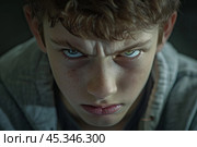 Young boy frowning and expressing anger and frustration. Стоковое AI-изображение, AI-художник Иван Рябоконь / Фотобанк Лори