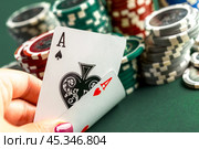 Cards and chips for poker on green table. Стоковое фото, фотограф Сергей Толмачёв / Фотобанк Лори