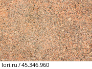 Granite texture. Natural granite with a grainy pattern. Stone background. Solid rough surface of rock. Durable construction and decoration material. Close-up. Стоковое фото, фотограф Андрей Степанов / Фотобанк Лори