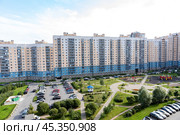 ЖК Аврора, Санкт-Петербург. New residential neighbourhood with typical simple buildings, parking and children playground. Affordable housing. Mortgage for young families. Редакционное фото, фотограф Ирина Михайличенко / Фотобанк Лори