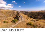 Aerial drone view of famous Vahramashen Church of the 11th century, located near destroyed Amberd fortress in sunny summer day. Cliff with Arkashian River deep in canyon. Aragatsotn region, Armenia. Стоковое фото, фотограф Алексей Ширманов / Фотобанк Лори