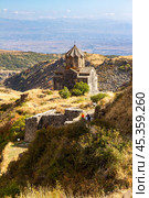 Famous view to ancient Vahramashen church of the 11th century, located near destroyed Amberd fortress in sunny summer day. Cliff with Arkashian River deep in canyon. Aragatsotn, Armenia. Стоковое фото, фотограф Алексей Ширманов / Фотобанк Лори