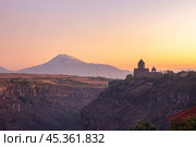 Beautiful View of Ararat and Hovhannavank monastery. Medieval church and Kasakh gorge and river canyon on evening autumn sunset. Aragatsotn Province, Armenia. Europe. Стоковое фото, фотограф Алексей Ширманов / Фотобанк Лори