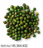 Pile of green peppercorns lying on a white background. Стоковое AI-изображение, AI-художник Иван Рябоконь / Фотобанк Лори