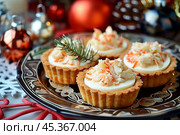 crab tartlets on the New Year's table. Стоковое AI-изображение, AI-художник Julia Lavleis / Фотобанк Лори